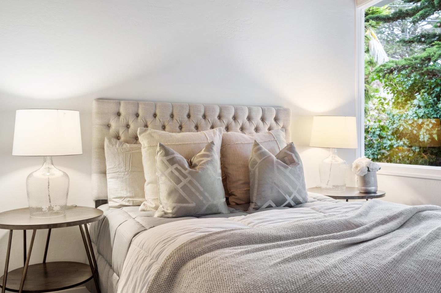 144 Kent Road Pacifica, CA 94044 - Photo 33 of 44 a white bed sitting in a bedroom next to a window