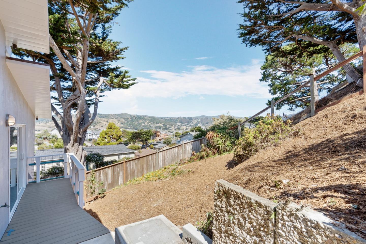 144 Kent Road Pacifica, CA 94044 - Photo 38 of 44 a view of a balcony with wooden fence