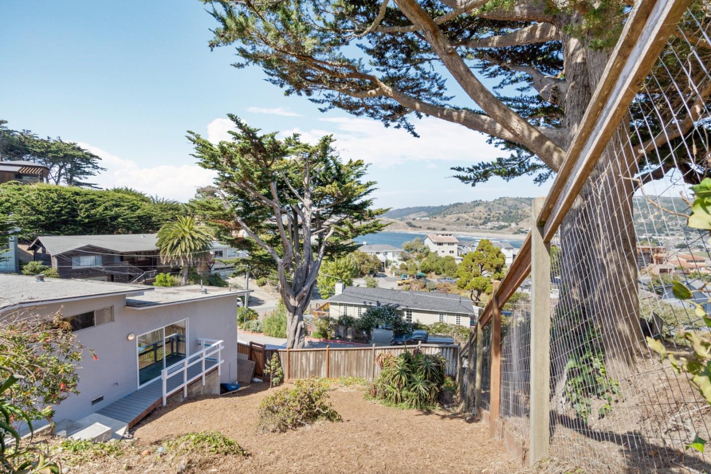 144 Kent Road Pacifica, CA 94044 - Photo 41 of 44 a view of a backyard with a tree