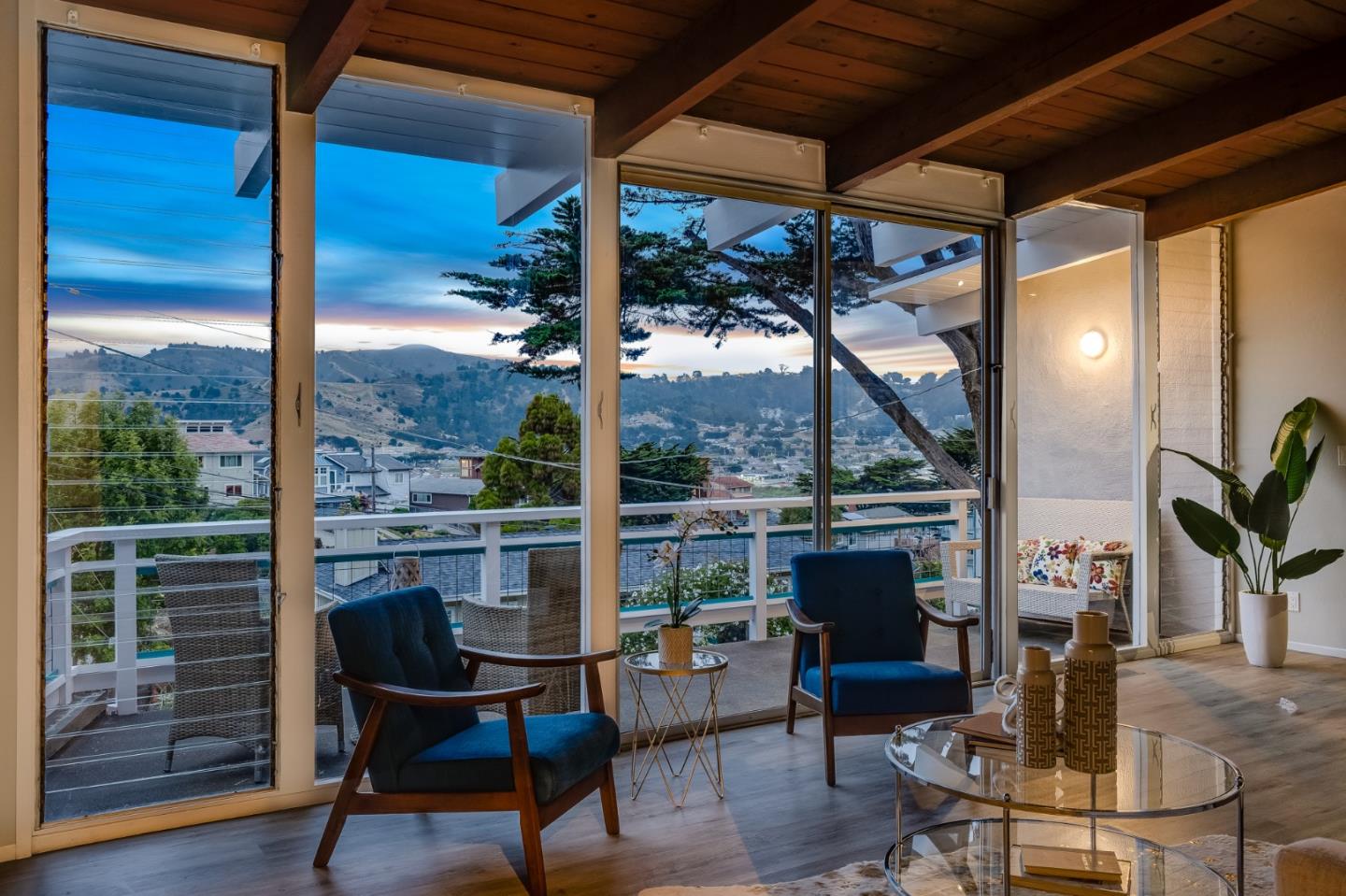 144 Kent Road Pacifica, CA 94044 - Photo 6 of 44 a view of a porch with chairs and couches
