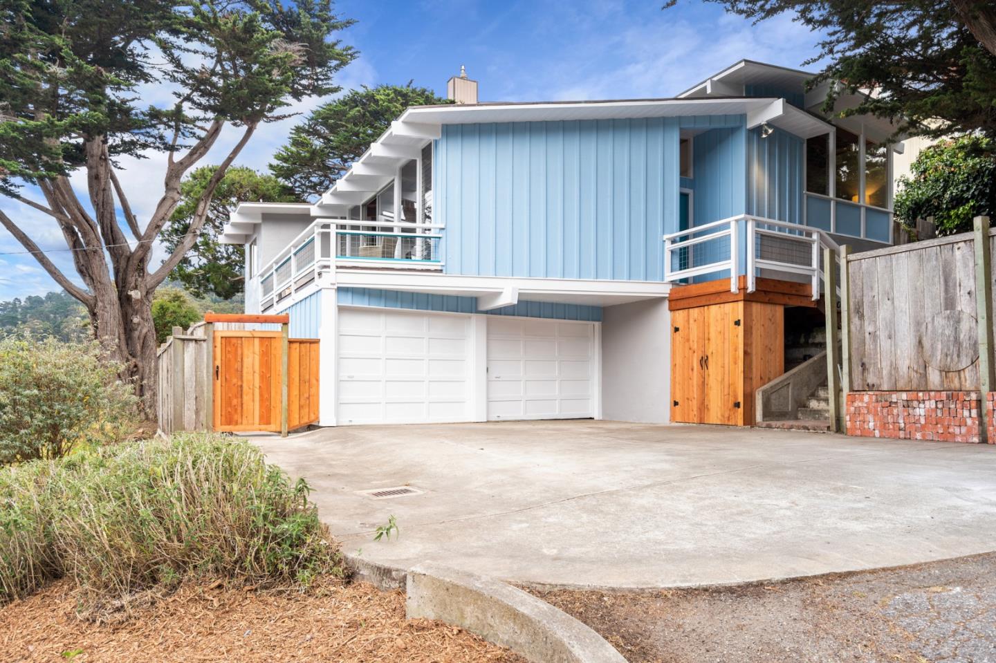 144 Kent Road Pacifica, CA 94044 - Photo 8 of 44 a front view of a house with garage