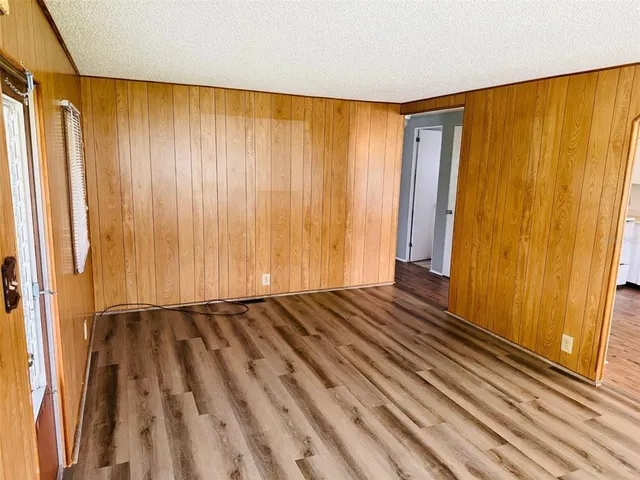 a view of a room with wooden walls