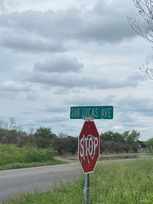 south of the stop sign 