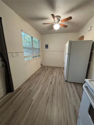 a view of livingroom with hardwood floor and a ceiling fan