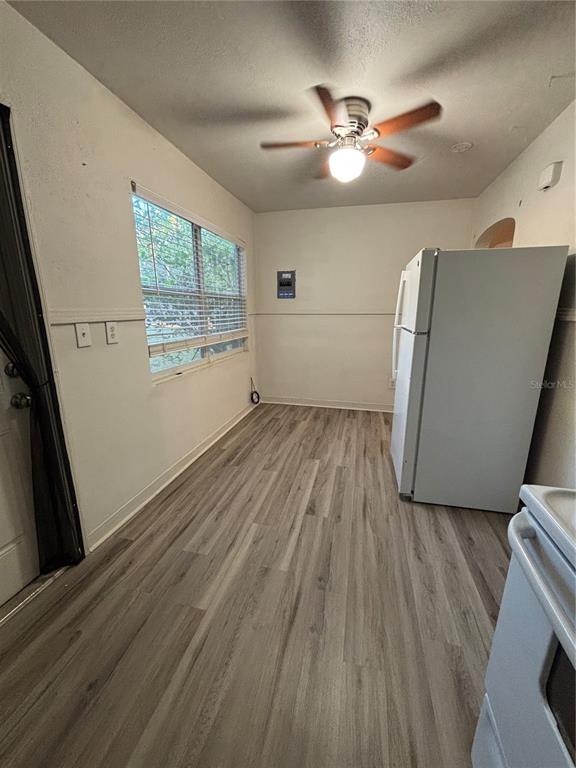 1102 Sunset Point Road, Unit 2 Clearwater, FL 33755 - Photo 7 of 17 a view of livingroom with hardwood floor and a ceiling fan