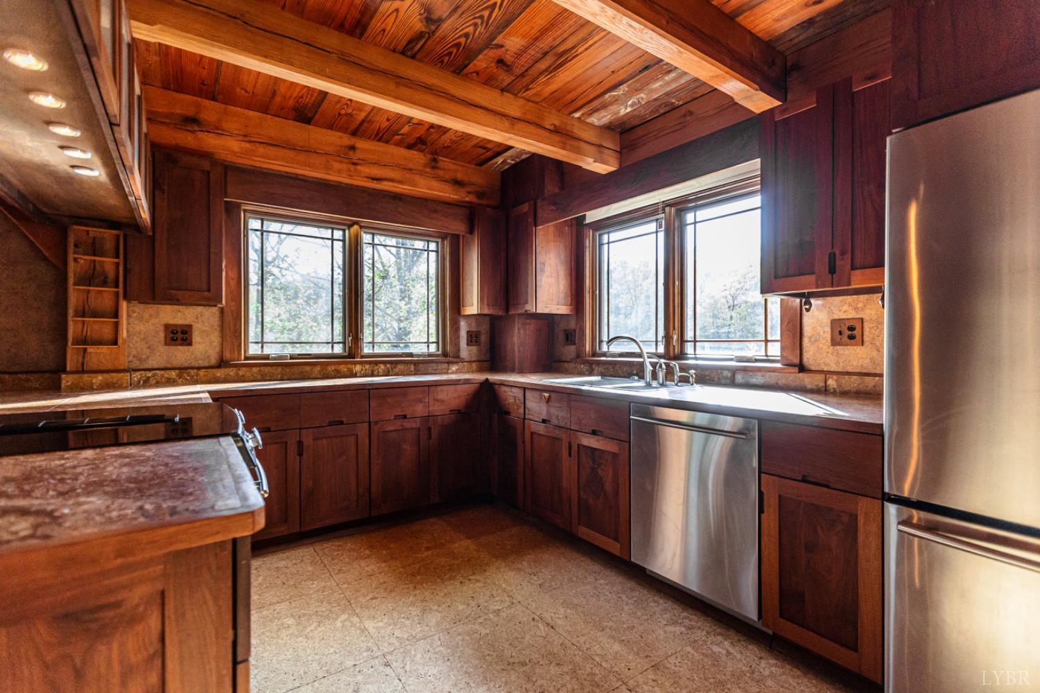 278 Salt Lick Lane Appomattox, VA 24522 - Photo 24 of 78 a kitchen with granite countertop a sink appliances a counter space and a window