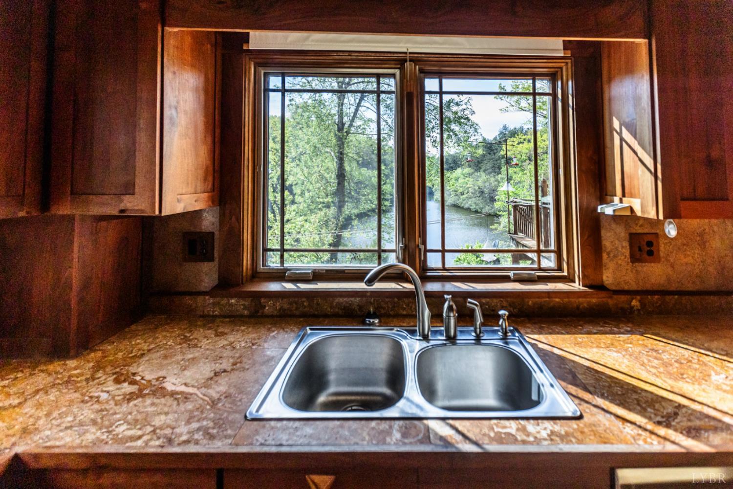 278 Salt Lick Lane Appomattox, VA 24522 - Photo 25 of 78 a kitchen with a sink and a large window