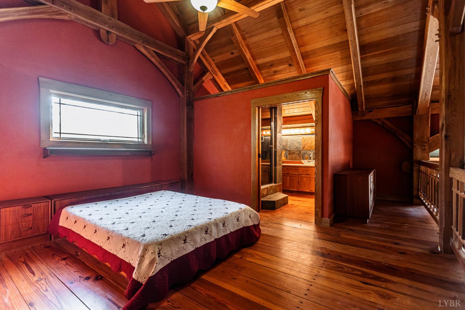 278 Salt Lick Lane Appomattox, VA 24522 - Photo 45 of 78 a bedroom with a bed and wooden floor