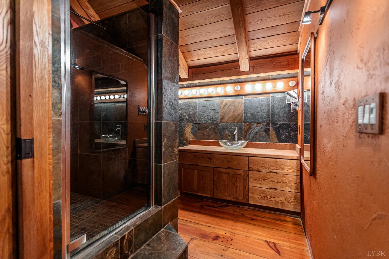278 Salt Lick Lane Appomattox, VA 24522 - Photo 48 of 78 a bathroom with a glass shower door
