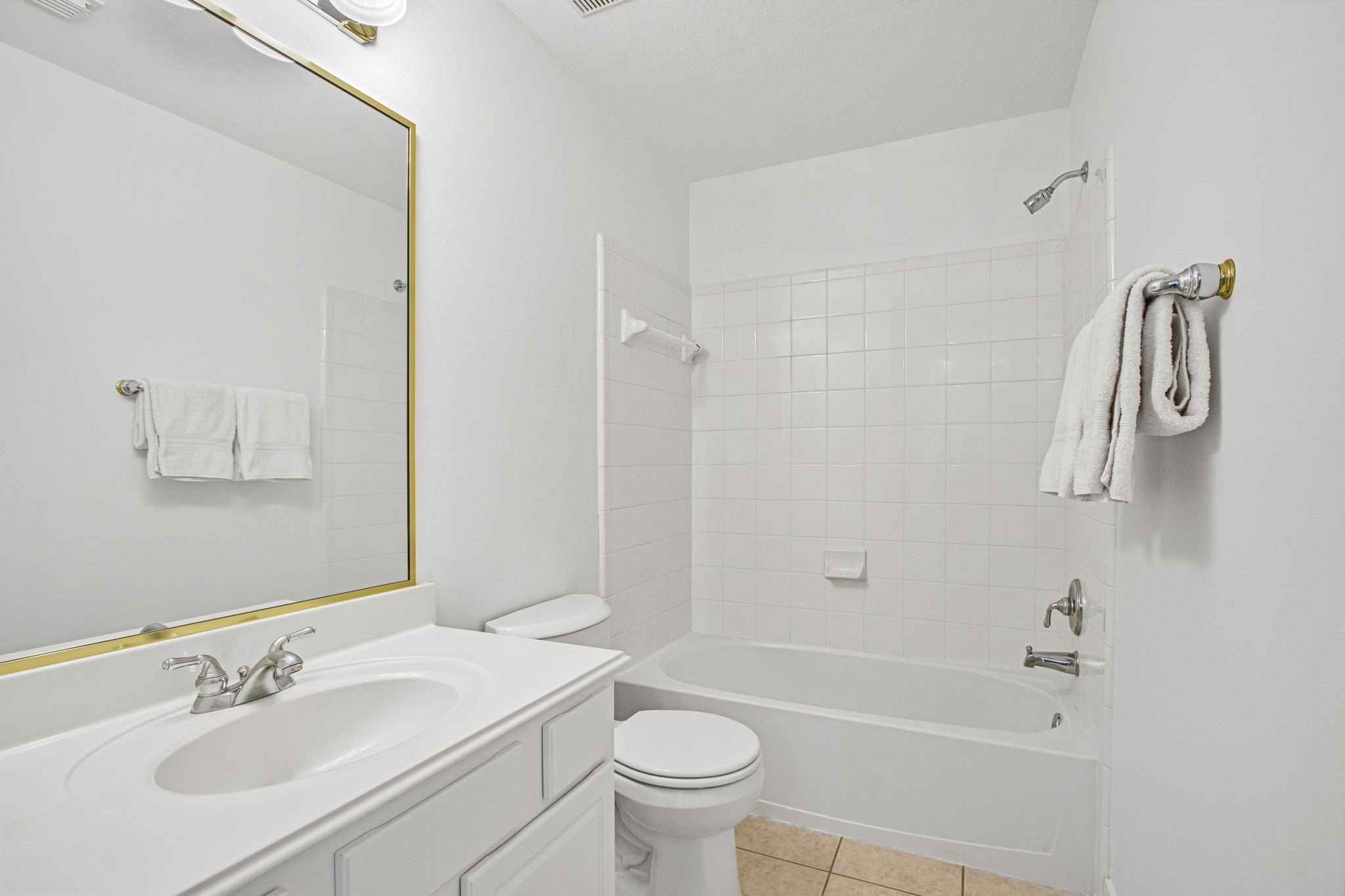 6731 Pinetop Glen Lane Spring, TX 77379 - Photo 32 of 47 a bathroom with a sink a toilet and a mirror