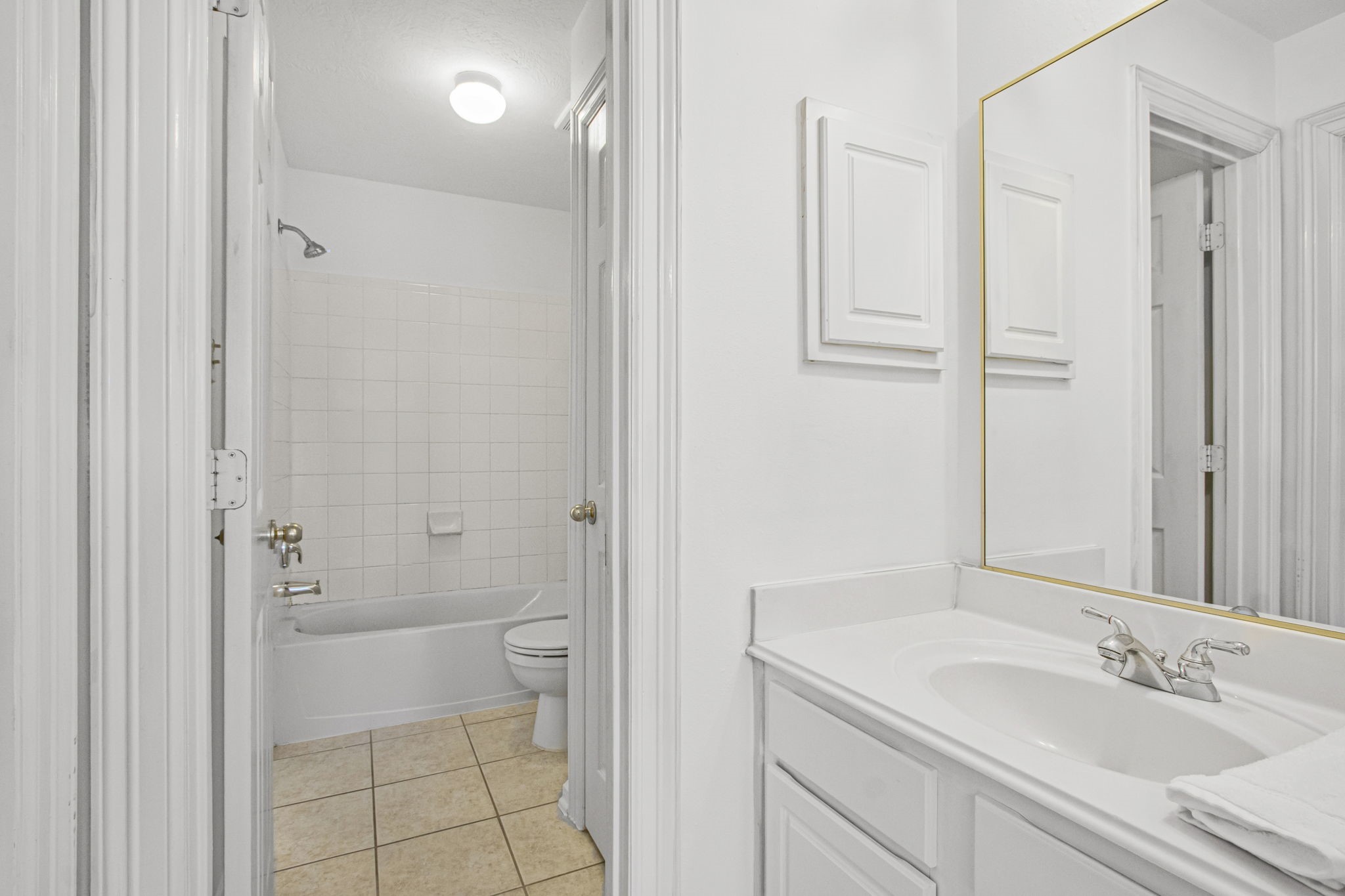 6731 Pinetop Glen Lane Spring, TX 77379 - Photo 36 of 47 a bathroom with a granite countertop sink a toilet and shower