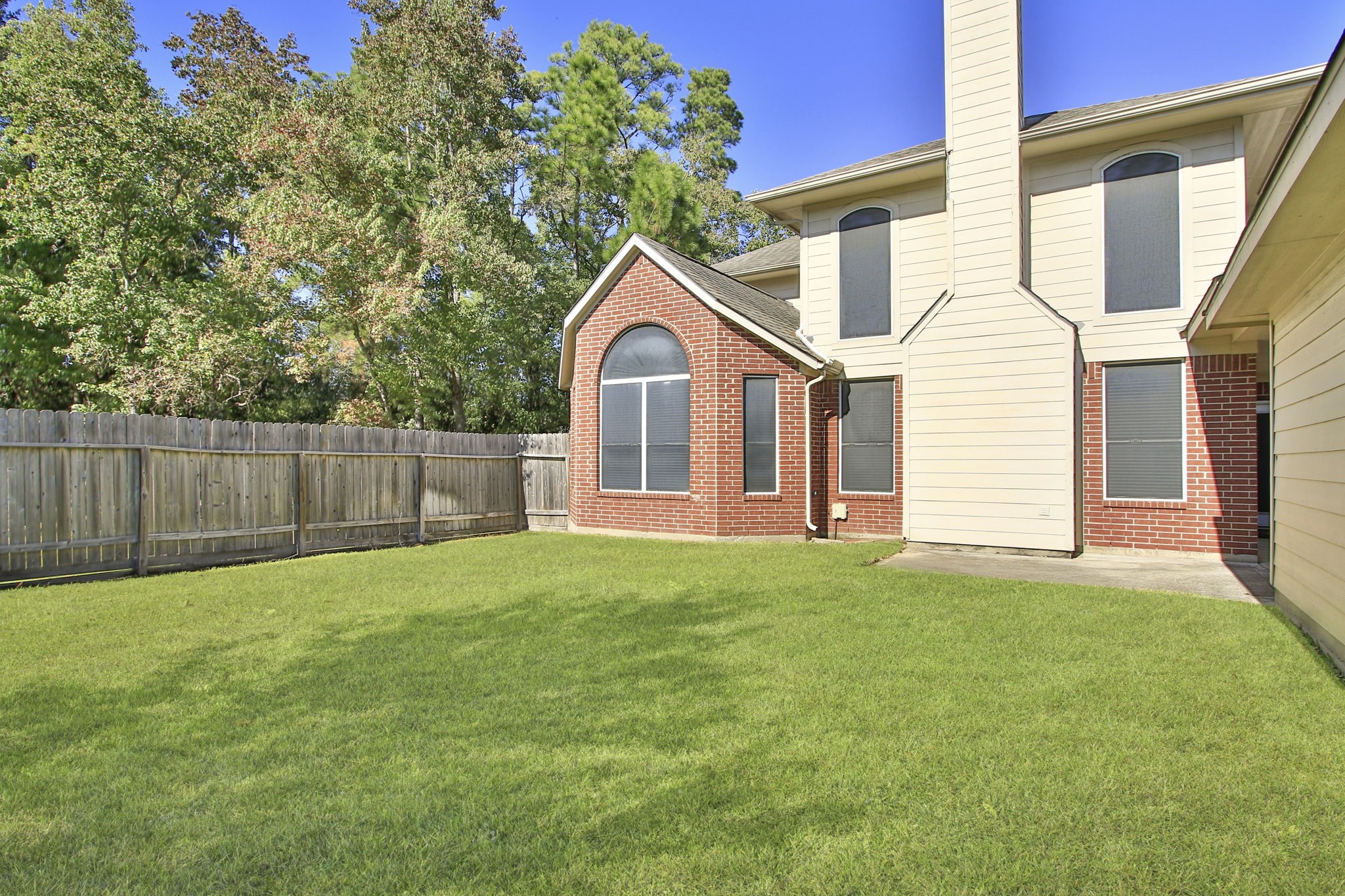 6731 Pinetop Glen Lane Spring, TX 77379 - Photo 41 of 47 a view of a yard in front of a house with large tree