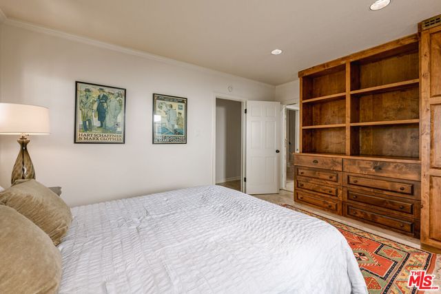 a bedroom with a bed and closet