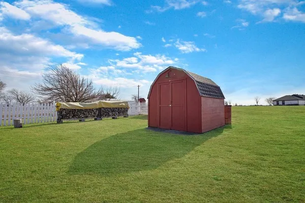 a view of building with an outdoor space and seating area