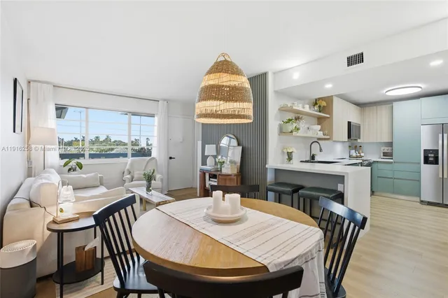 a dining room with furniture and window