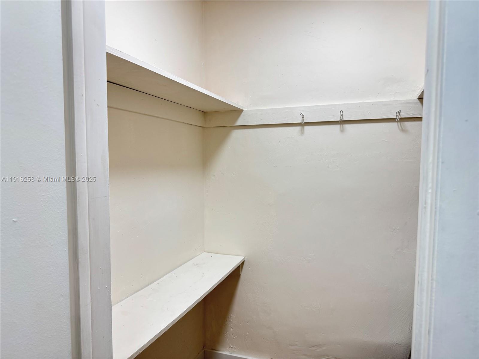 1100 11th Street, Unit 405 Miami Beach, FL 33139 - Photo 14 of 28 a view of walk in closet with empty racks