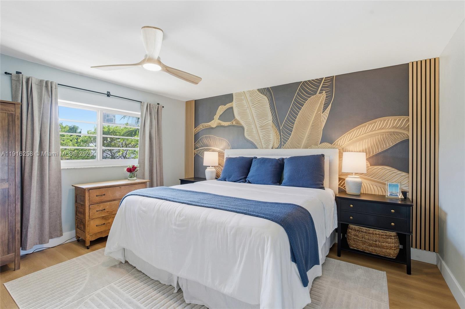 1100 11th Street, Unit 405 Miami Beach, FL 33139 - Photo 17 of 28 a bedroom with a large bed and a window