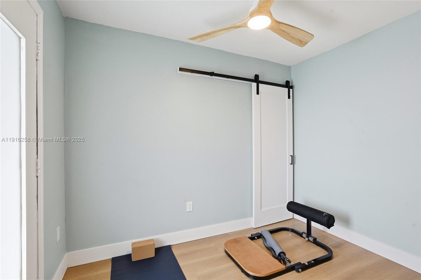 1100 11th Street, Unit 405 Miami Beach, FL 33139 - Photo 22 of 28 a room with a window and wooden floor