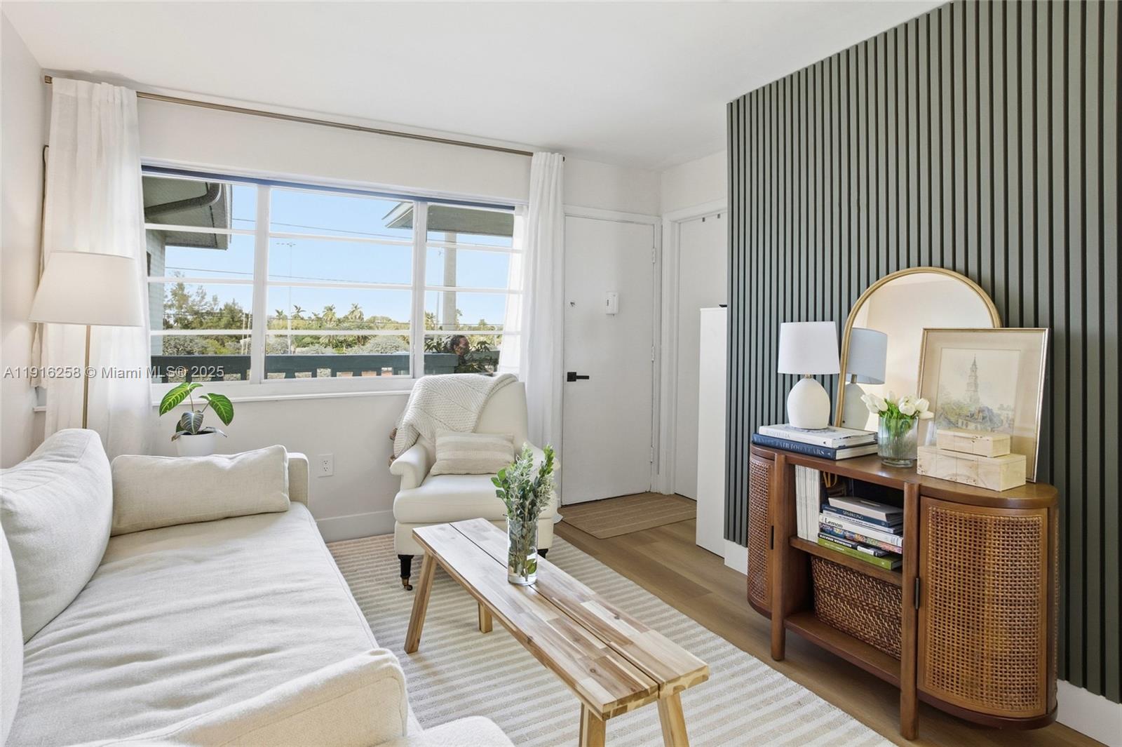 1100 11th Street, Unit 405 Miami Beach, FL 33139 - Photo 3 of 28 a living room with furniture and a wooden floor