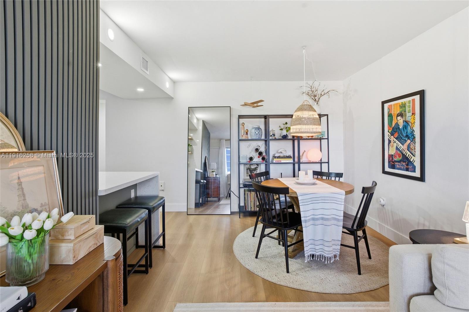 1100 11th Street, Unit 405 Miami Beach, FL 33139 - Photo 6 of 28 a view of a dining room with furniture and wooden floor