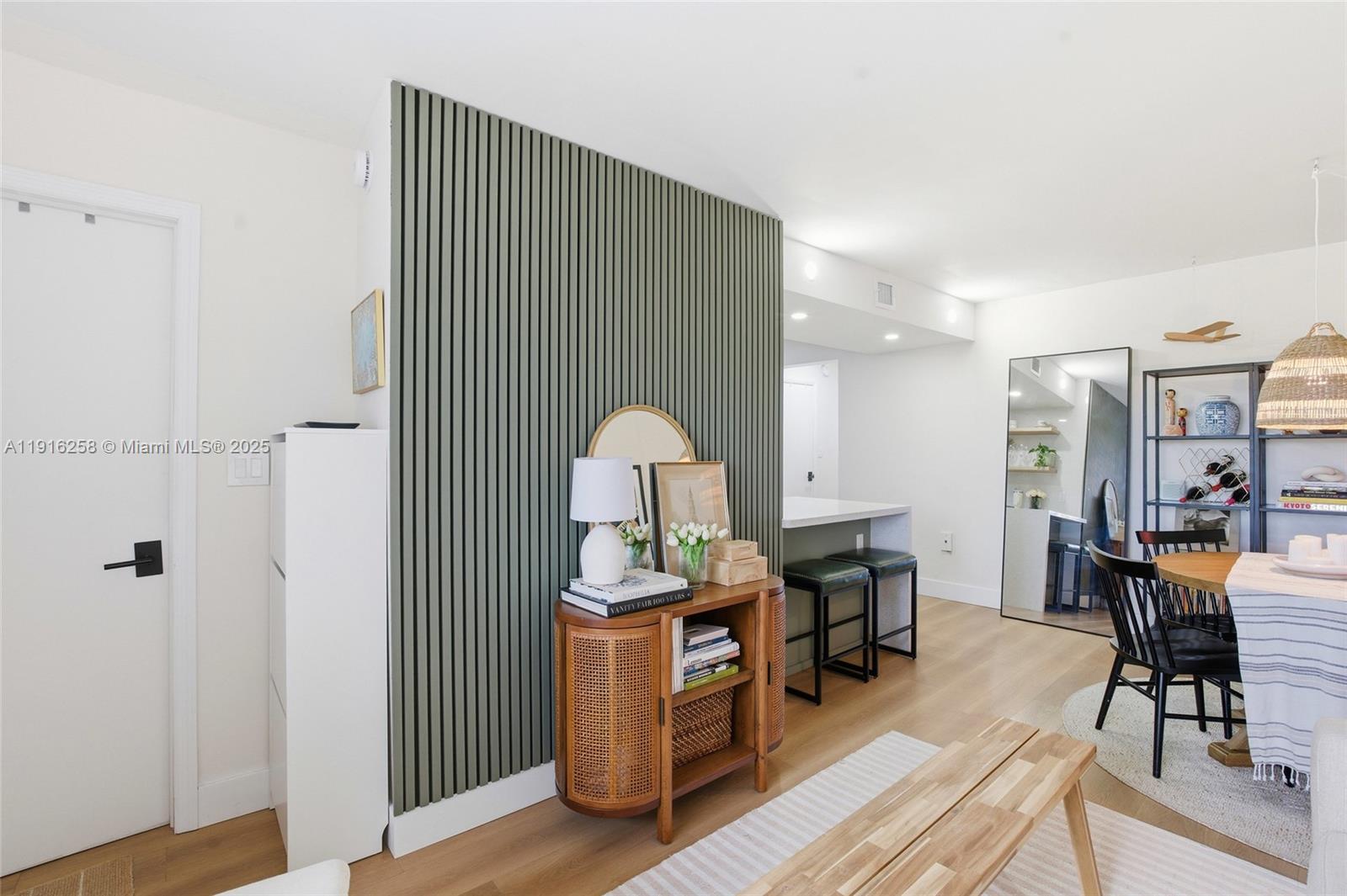 1100 11th Street, Unit 405 Miami Beach, FL 33139 - Photo 7 of 28 a living room with furniture and a wooden floor
