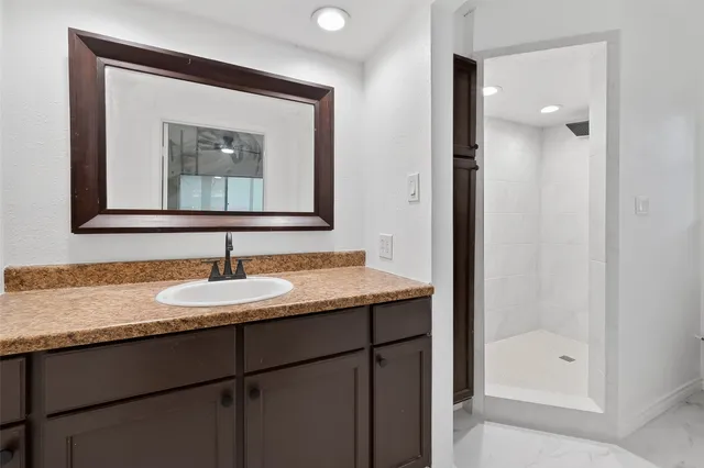 a large house with a big yard and large trees