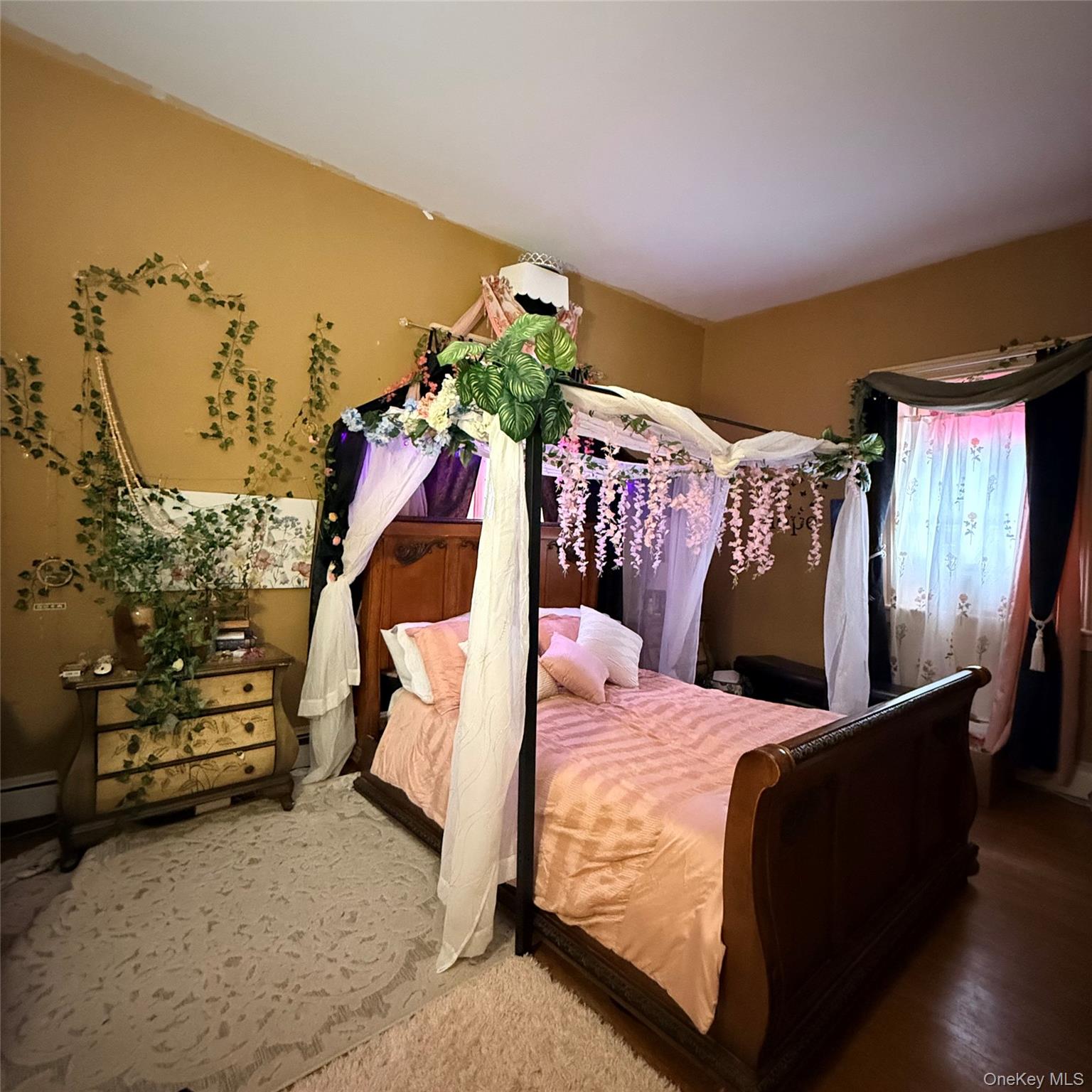 45 Maple Street Walden, NY 12586 - Photo 17 of 20 a bed room with a bed and a fan