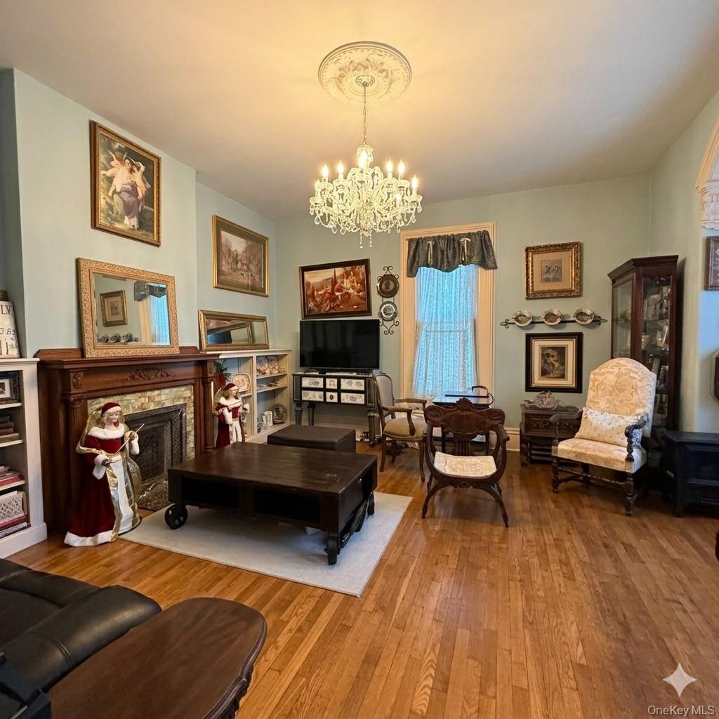 45 Maple Street Walden, NY 12586 - Photo 6 of 20 a living room with furniture and a chandelier