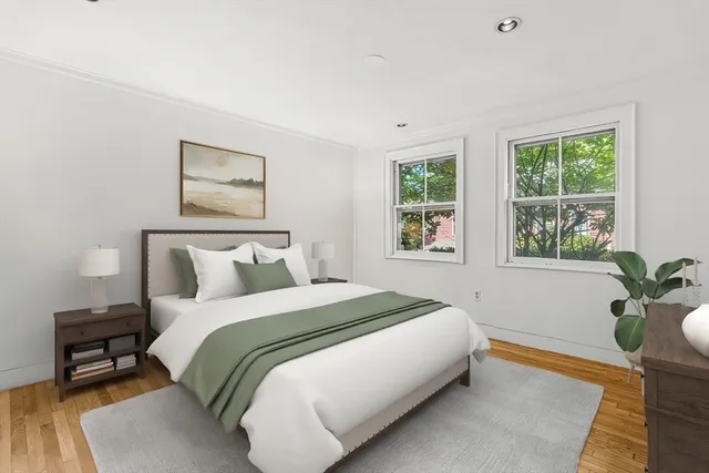 a bedroom with bed and a window