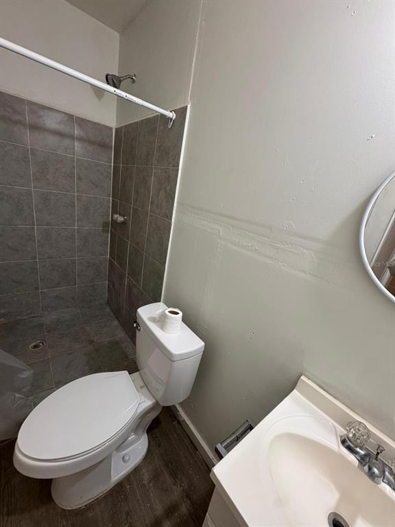 4201 Cepeda Street Orlando, FL 32811 - Photo 6 of 17 a bathroom with a toilet sink and shower