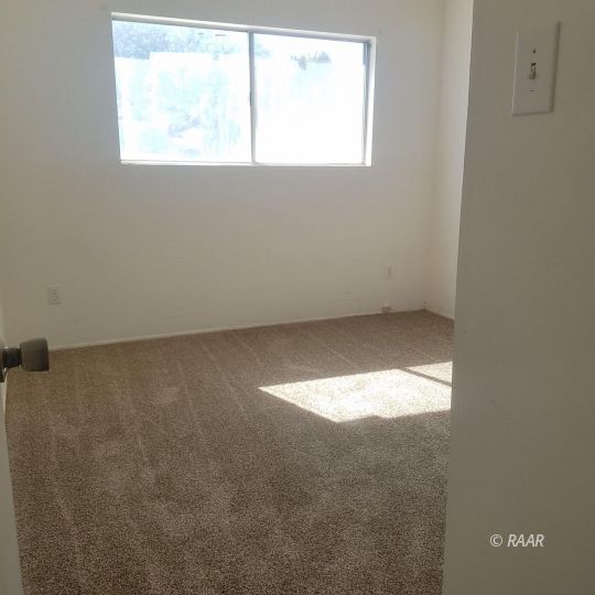 324 West Perdew Avenue Ridgecrest, CA 93555 - Photo 11 of 14 an empty room with a window