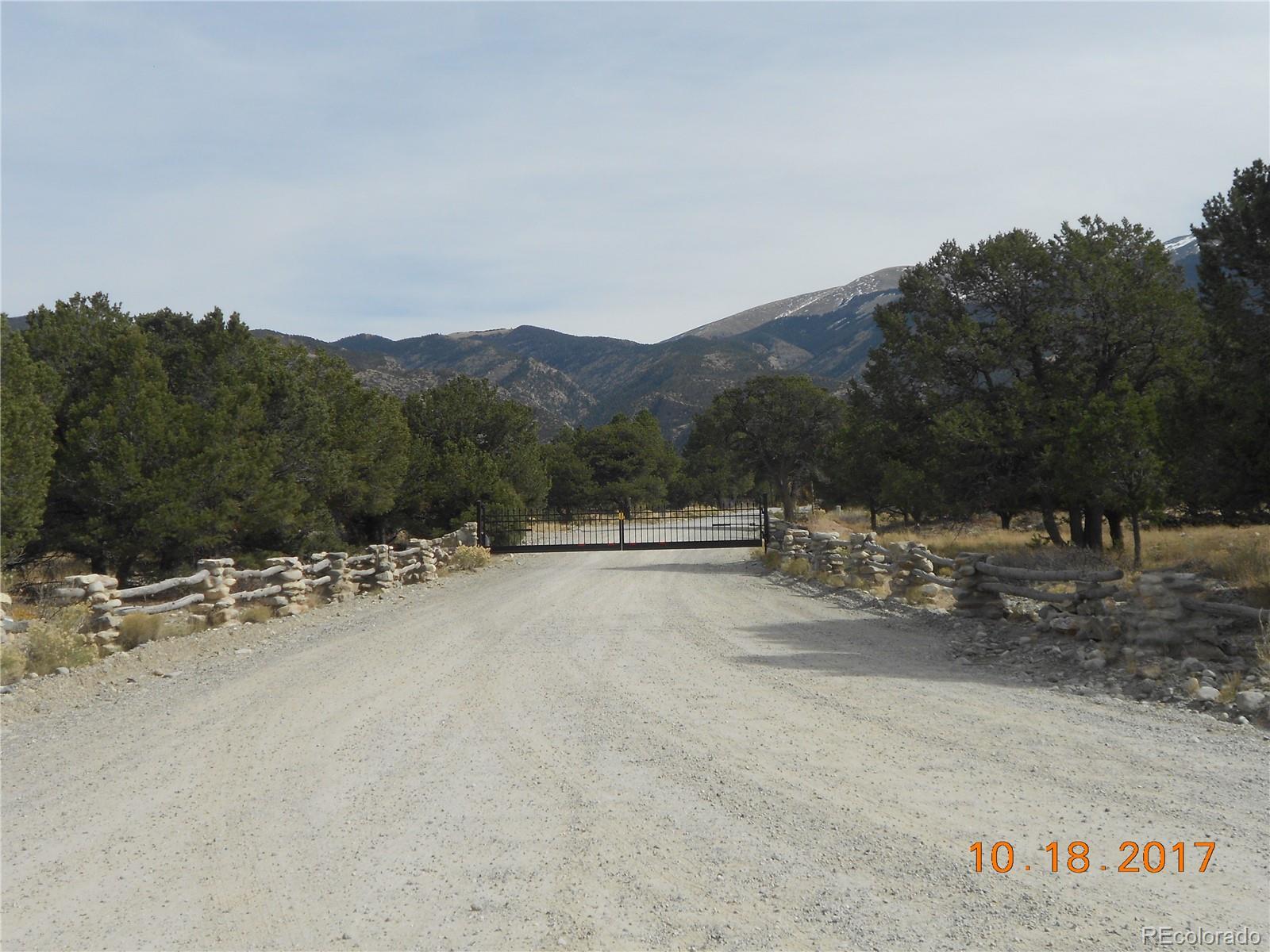 Mill Run Road Mosca, CO 81146 - Photo 8 of 12 a view of a road with a building in the background