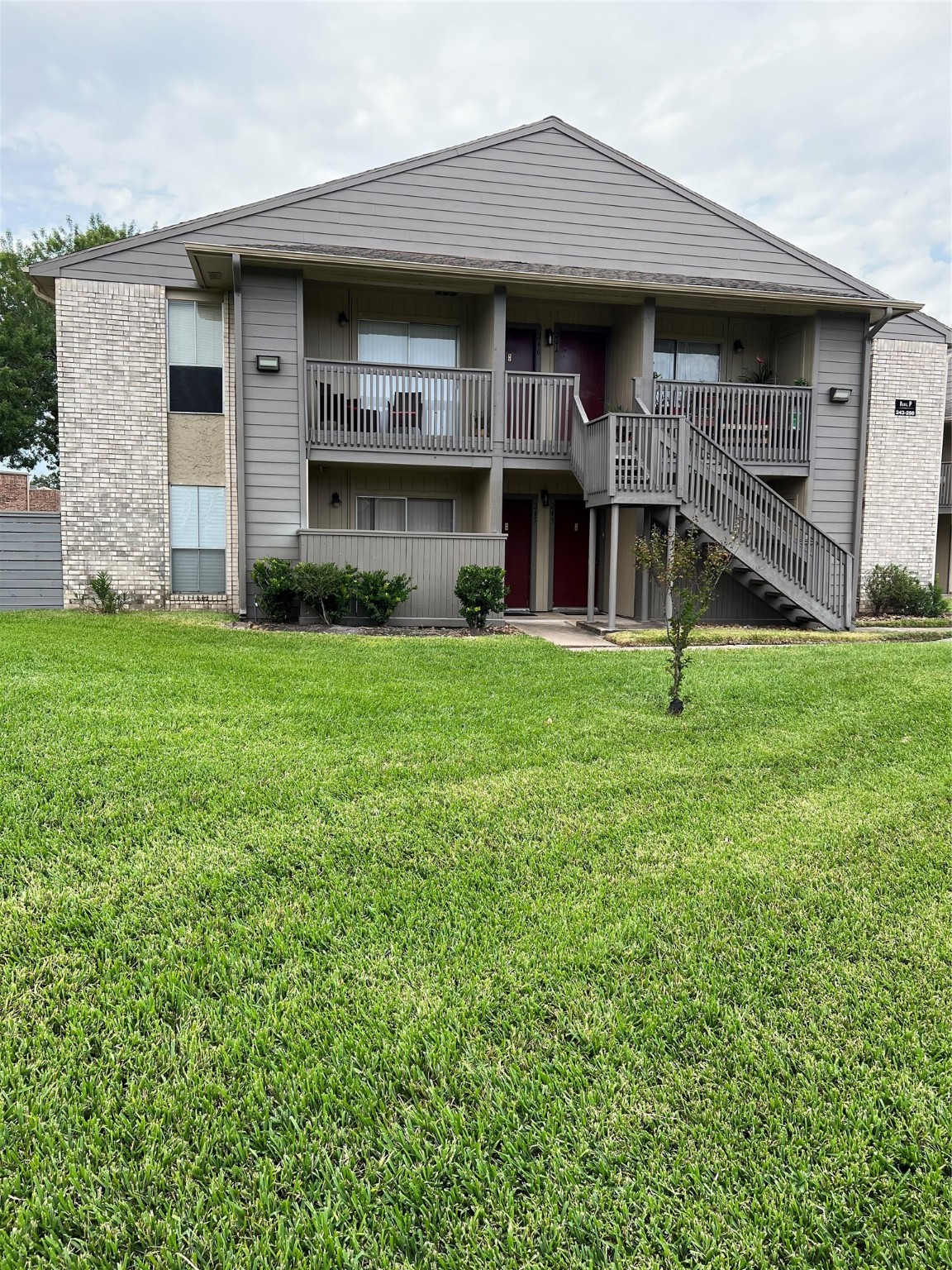 1900 Bay Area Boulevard, Unit 243 Houston, TX 77058 - Photo 1 of 10 a front view of a house with a yard
