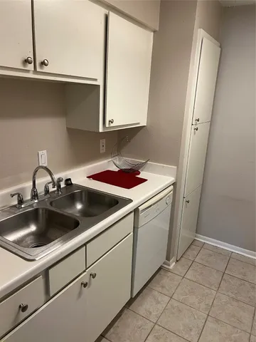 a kitchen with a sink and cabinets