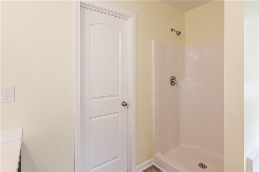 1562 Onalee Drive Hampton, GA 30228 - Photo 18 of 22 a bathroom with a shower