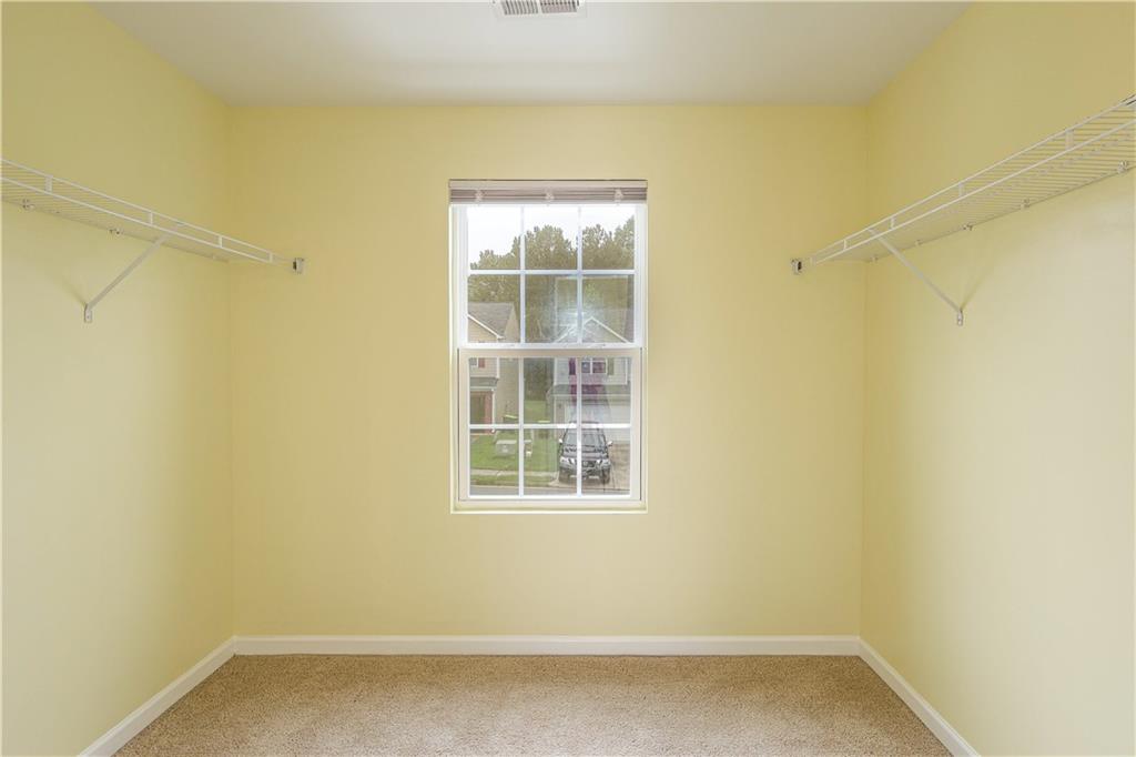 1562 Onalee Drive Hampton, GA 30228 - Photo 19 of 22 a view of a small space with wooden floor and a window