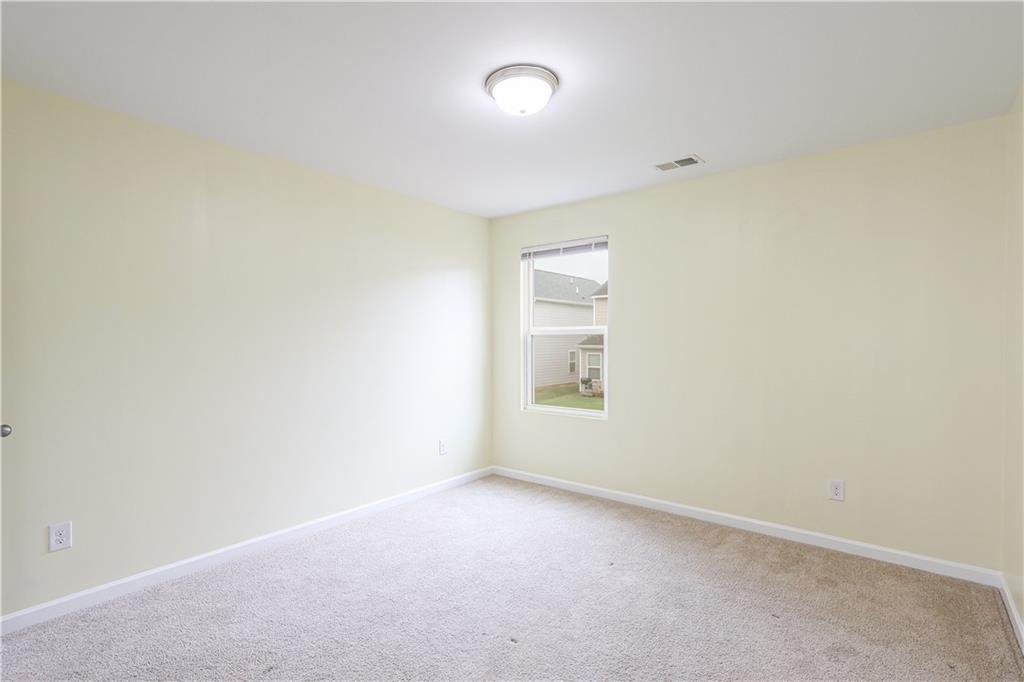 1562 Onalee Drive Hampton, GA 30228 - Photo 20 of 22 an empty room with a window