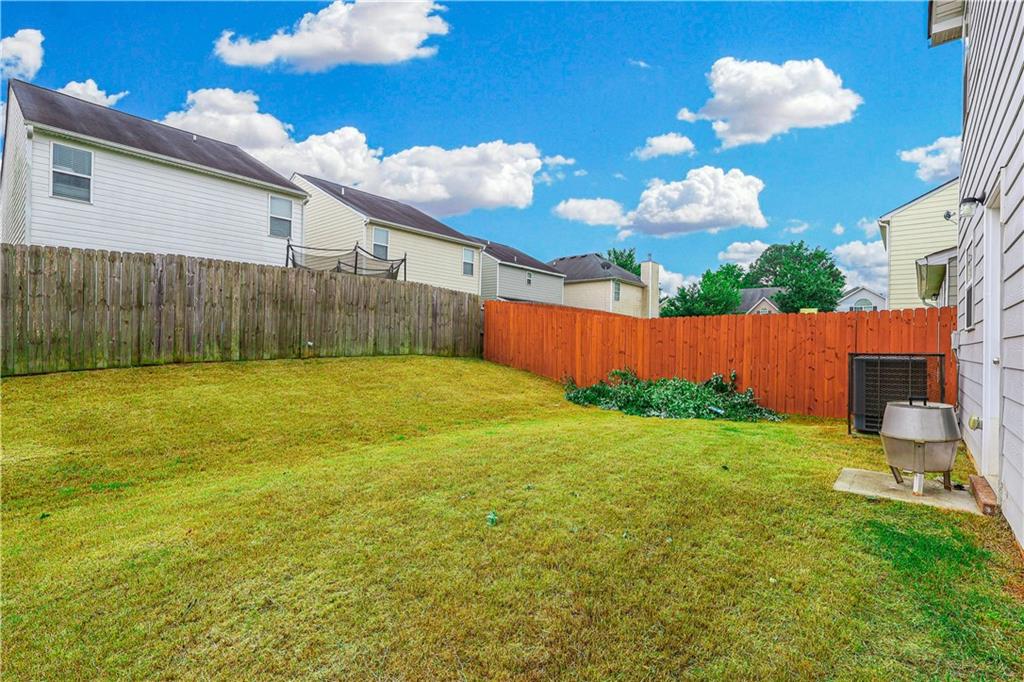 1562 Onalee Drive Hampton, GA 30228 - Photo 4 of 22 a view of a backyard