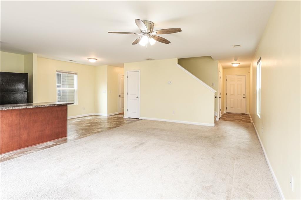 1562 Onalee Drive Hampton, GA 30228 - Photo 7 of 22 a view of a livingroom with a kitchen stove and a microwave
