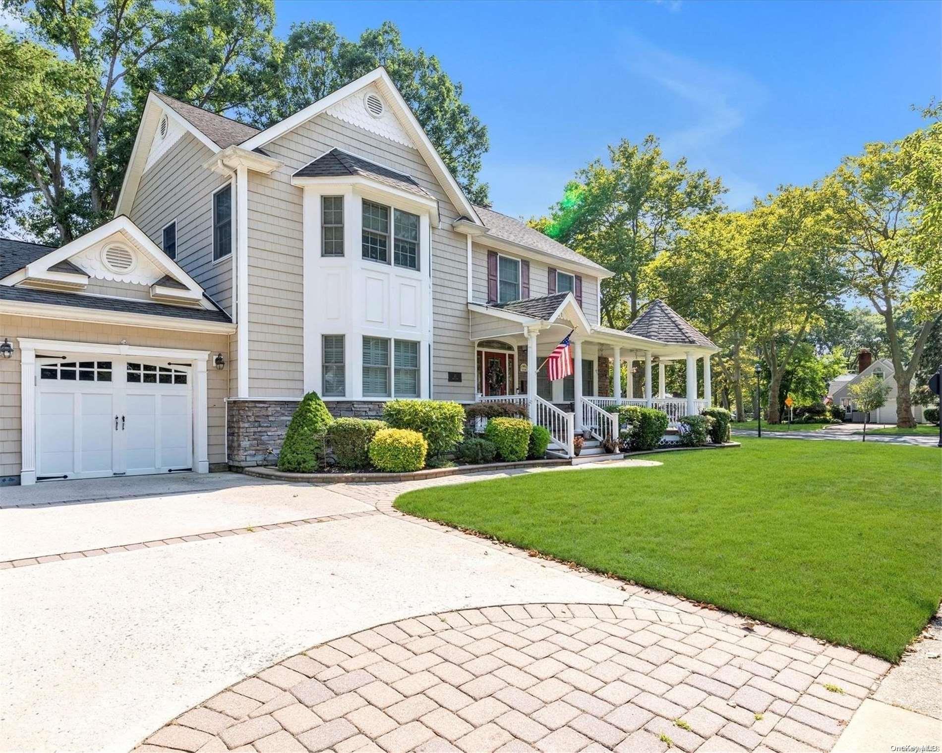 21 Shaw Drive Merrick, NY 11566 - Photo 1 of 1 a front view of a house with a yard