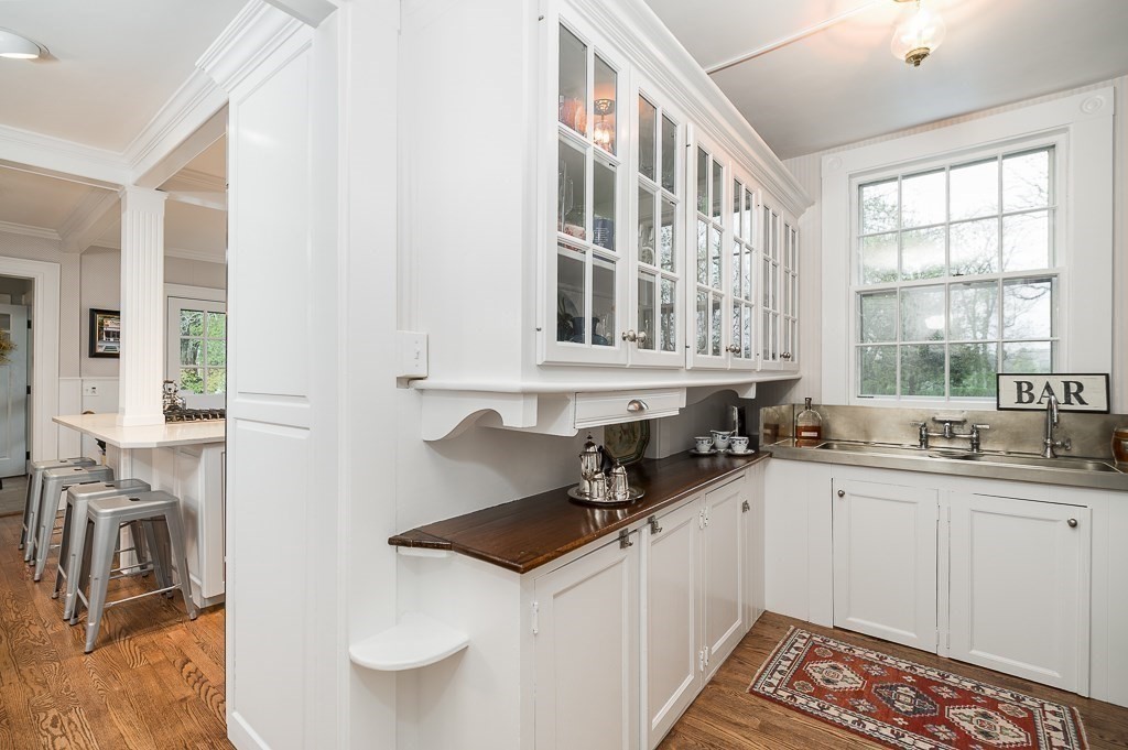 6 Jersey Lane Manchester, MA 01944 - Photo 15 of 42 a kitchen with granite countertop a sink a stove and cabinets