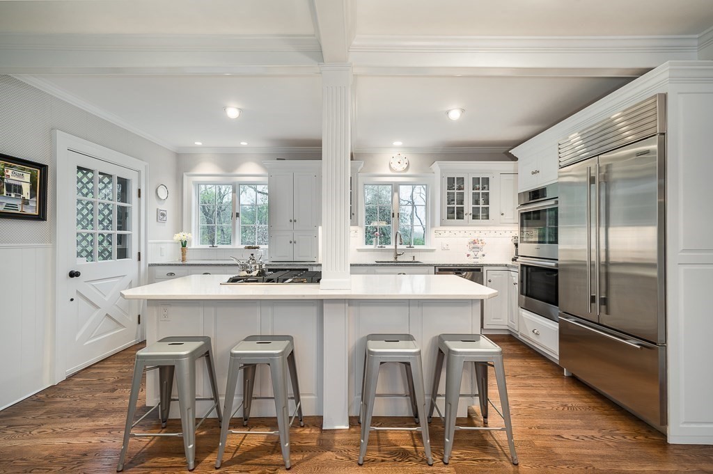 6 Jersey Lane Manchester, MA 01944 - Photo 16 of 42 a large kitchen with a table and chairs
