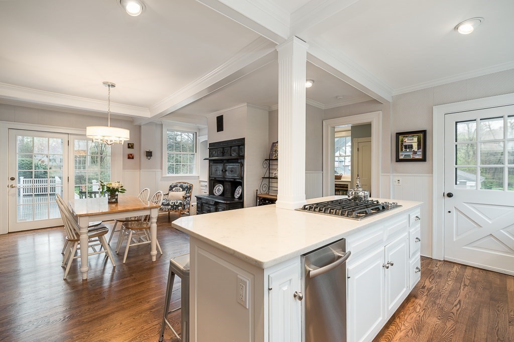 6 Jersey Lane Manchester, MA 01944 - Photo 17 of 42 a kitchen with a stove a table and chairs