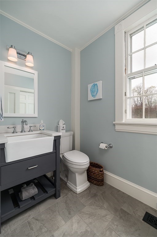 6 Jersey Lane Manchester, MA 01944 - Photo 20 of 42 a bathroom with a sink a toilet and a window