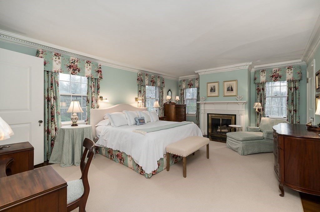6 Jersey Lane Manchester, MA 01944 - Photo 25 of 42 a bed room with furniture and a fireplace