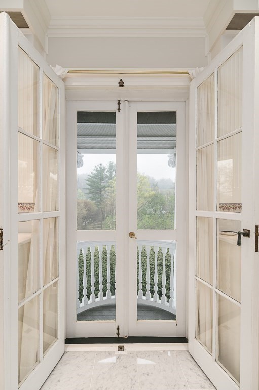 6 Jersey Lane Manchester, MA 01944 - Photo 27 of 42 a view of an entryway with wooden floor and garden
