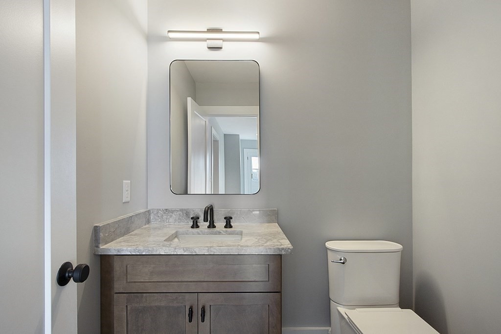 32 Lanes Road Westminster, MA 01473 - Photo 18 of 42 a bathroom with a toilet sink and mirror