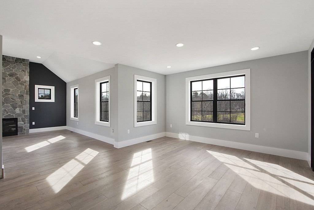32 Lanes Road Westminster, MA 01473 - Photo 23 of 42 a view of an empty room with a window and wooden floor