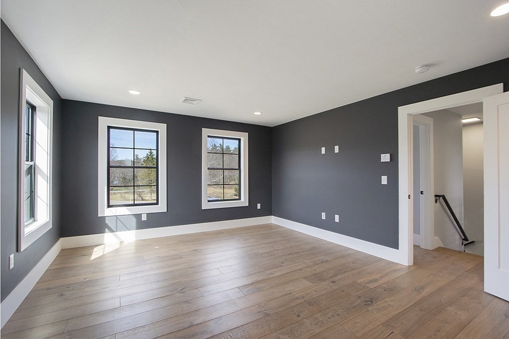 32 Lanes Road Westminster, MA 01473 - Photo 29 of 42 a view of an empty room with a window and wooden floor