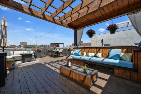 a outdoor living space with furniture and wooden floor